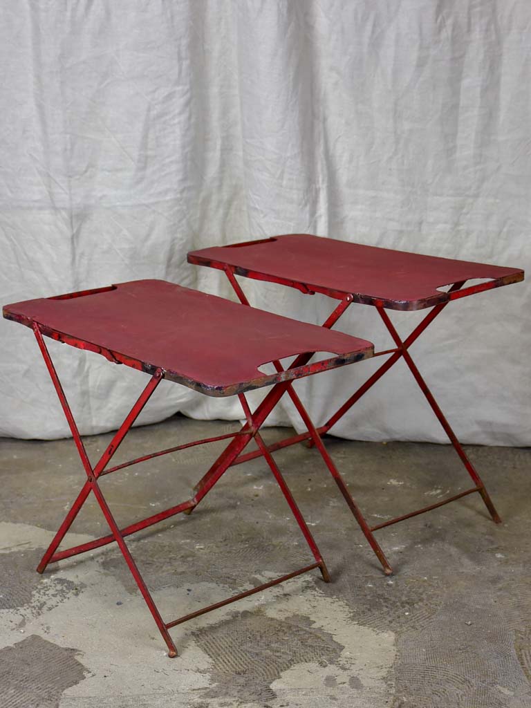 Two industrial French side tables - red