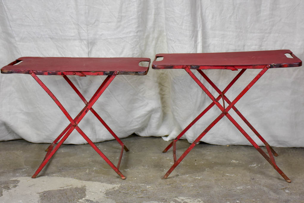 Two industrial French side tables - red