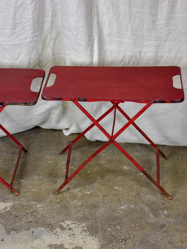 Two industrial French side tables - red