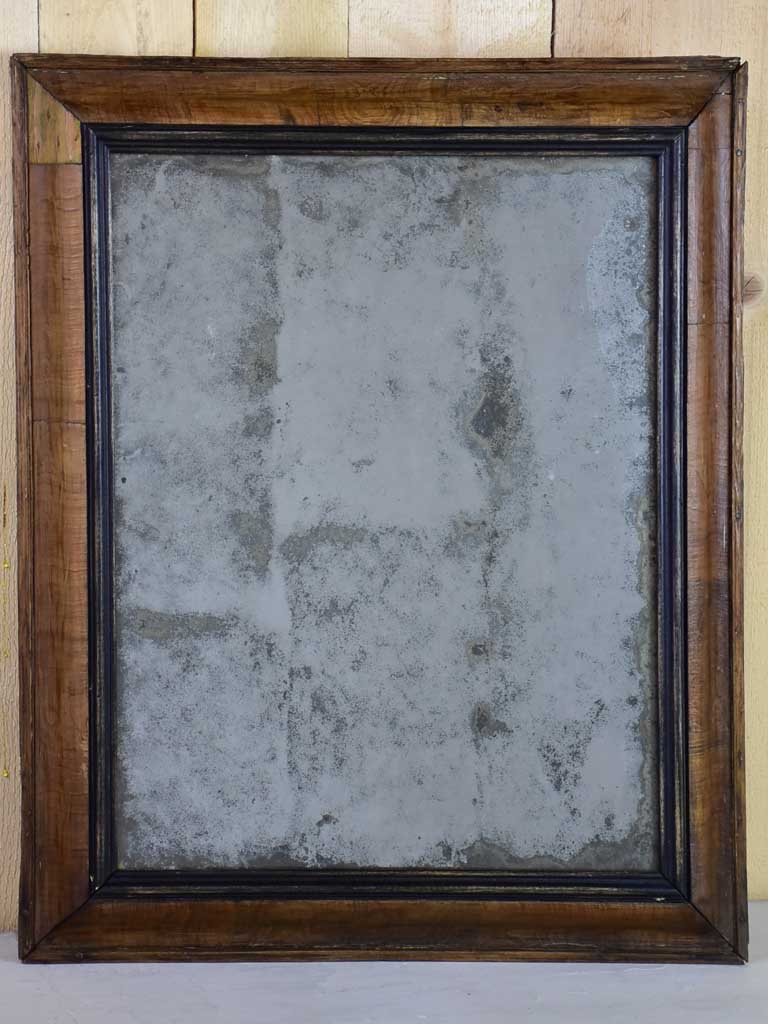 Antique French mirror with heavily aged glass and simple wooden frame 19¾" x 24"