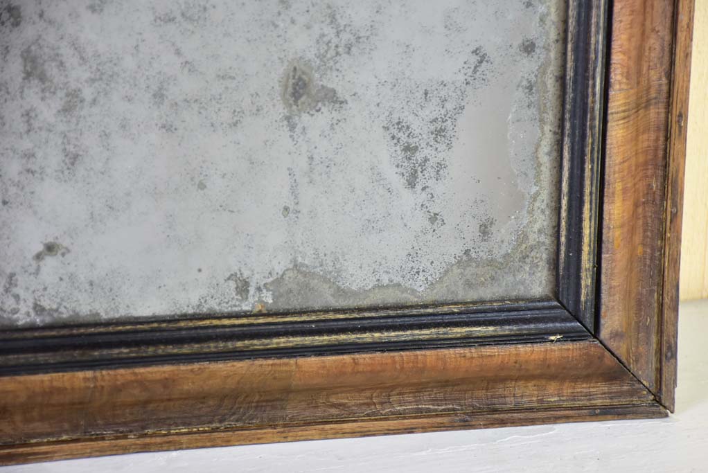 Antique French mirror with heavily aged glass and simple wooden frame 19¾" x 24"