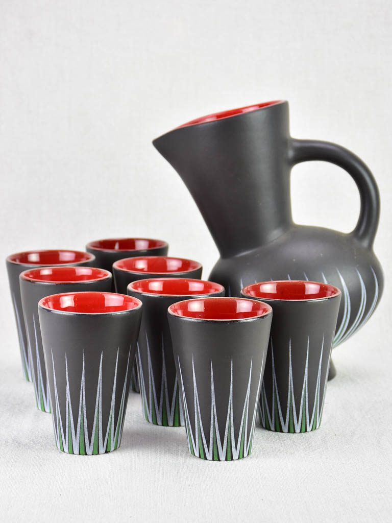 Andre Baud Vallauris set of eight cups and tilted pitcher - black white red and green