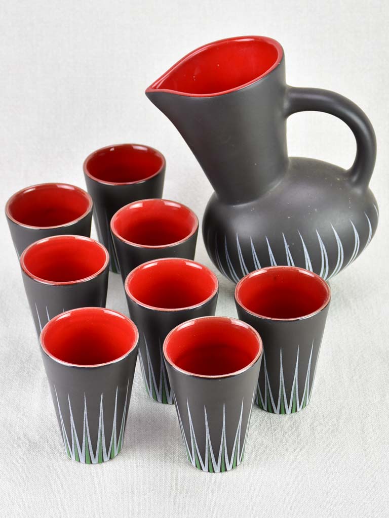 Andre Baud Vallauris set of eight cups and tilted pitcher - black white red and green