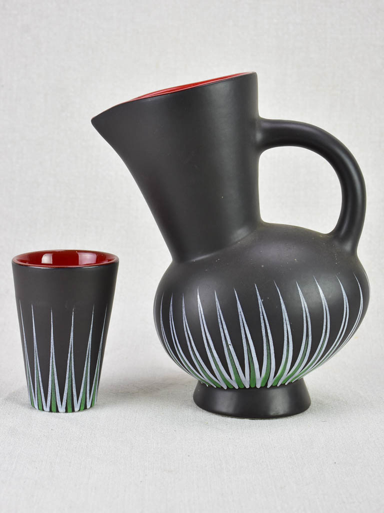 Andre Baud Vallauris set of eight cups and tilted pitcher - black white red and green