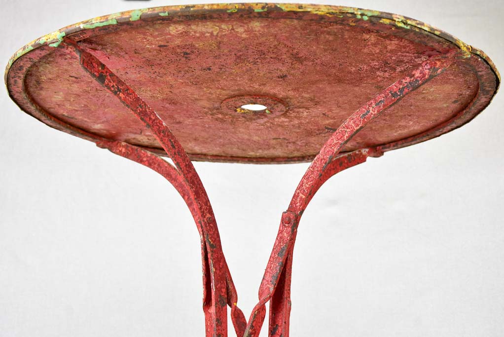 Early twentieth century bistro garden table with yellow and red patina