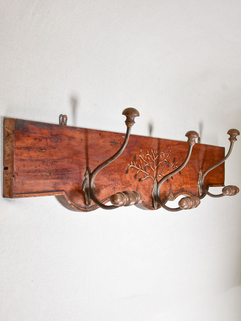 Salvaged 19th Century coat rack with olive tree marquetry 44"