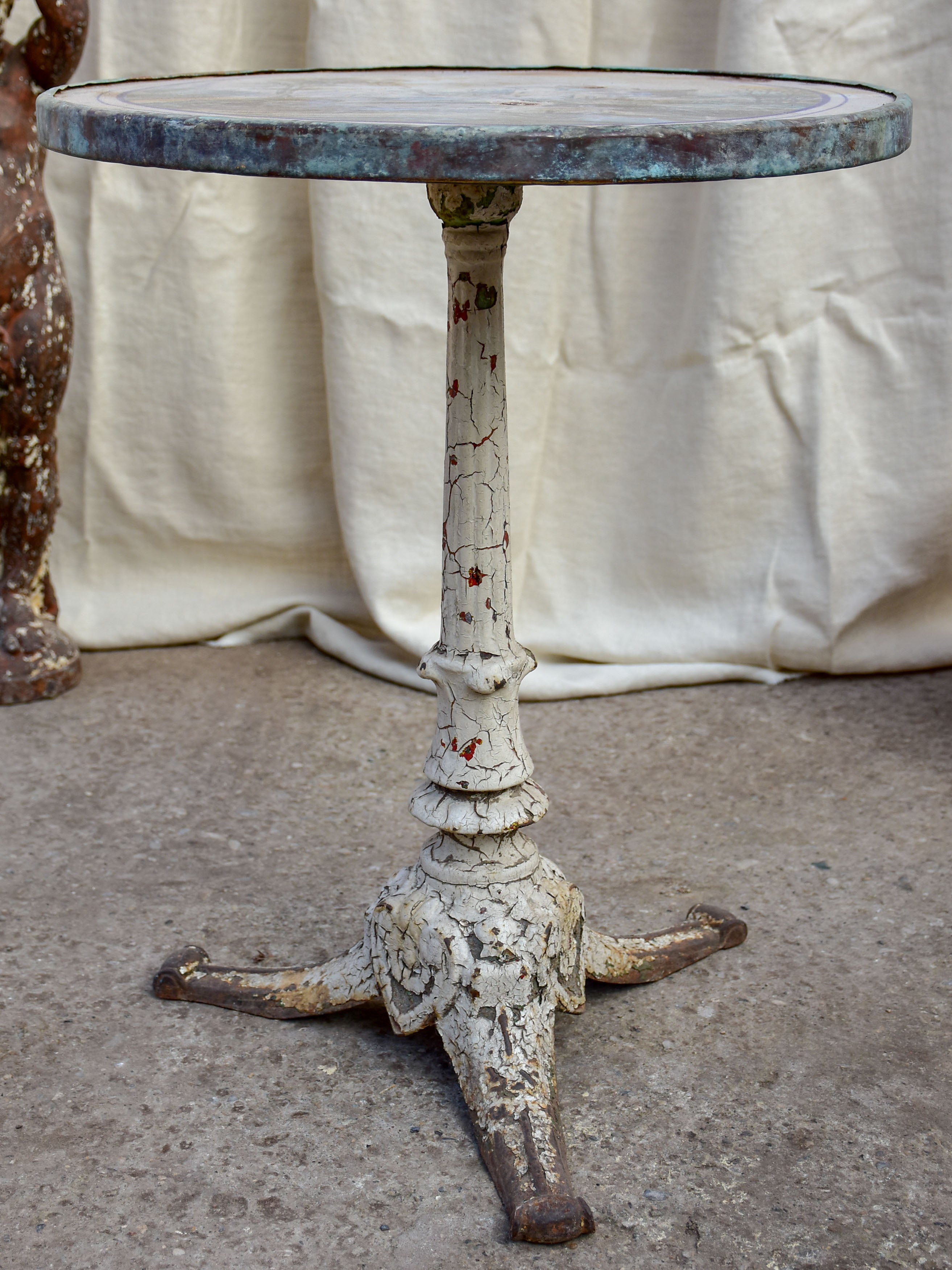 Antique French bistro table with decorative top