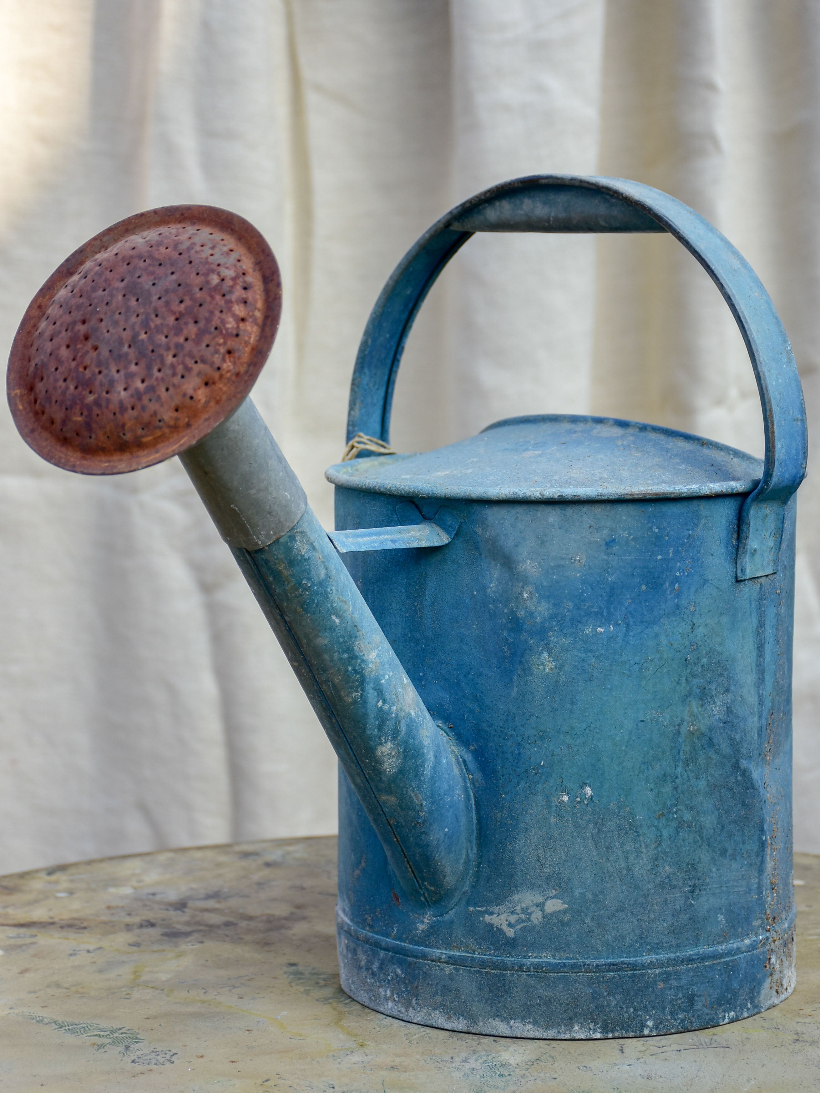 Antique French watering can with blue patina