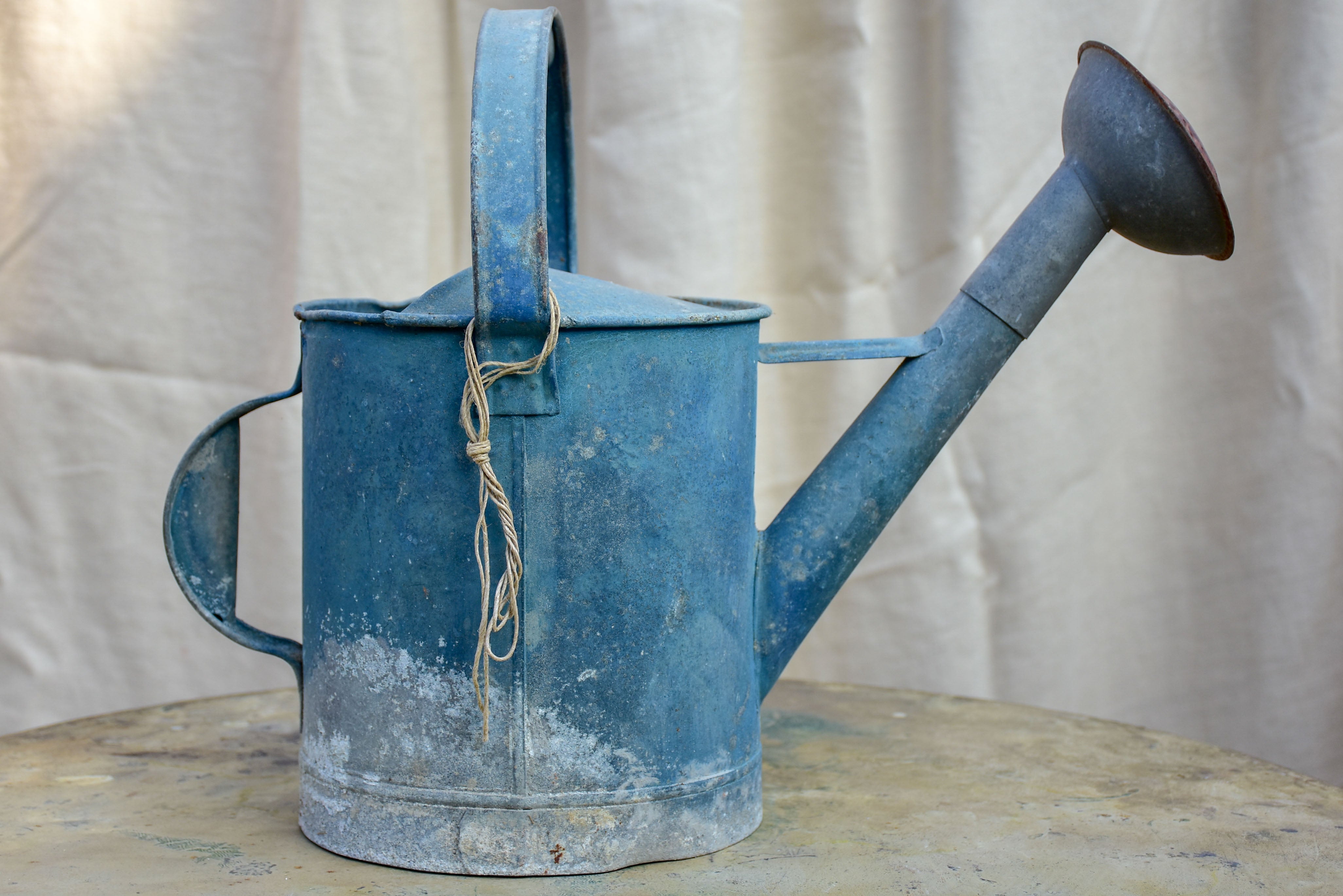 Antique French watering can with blue patina