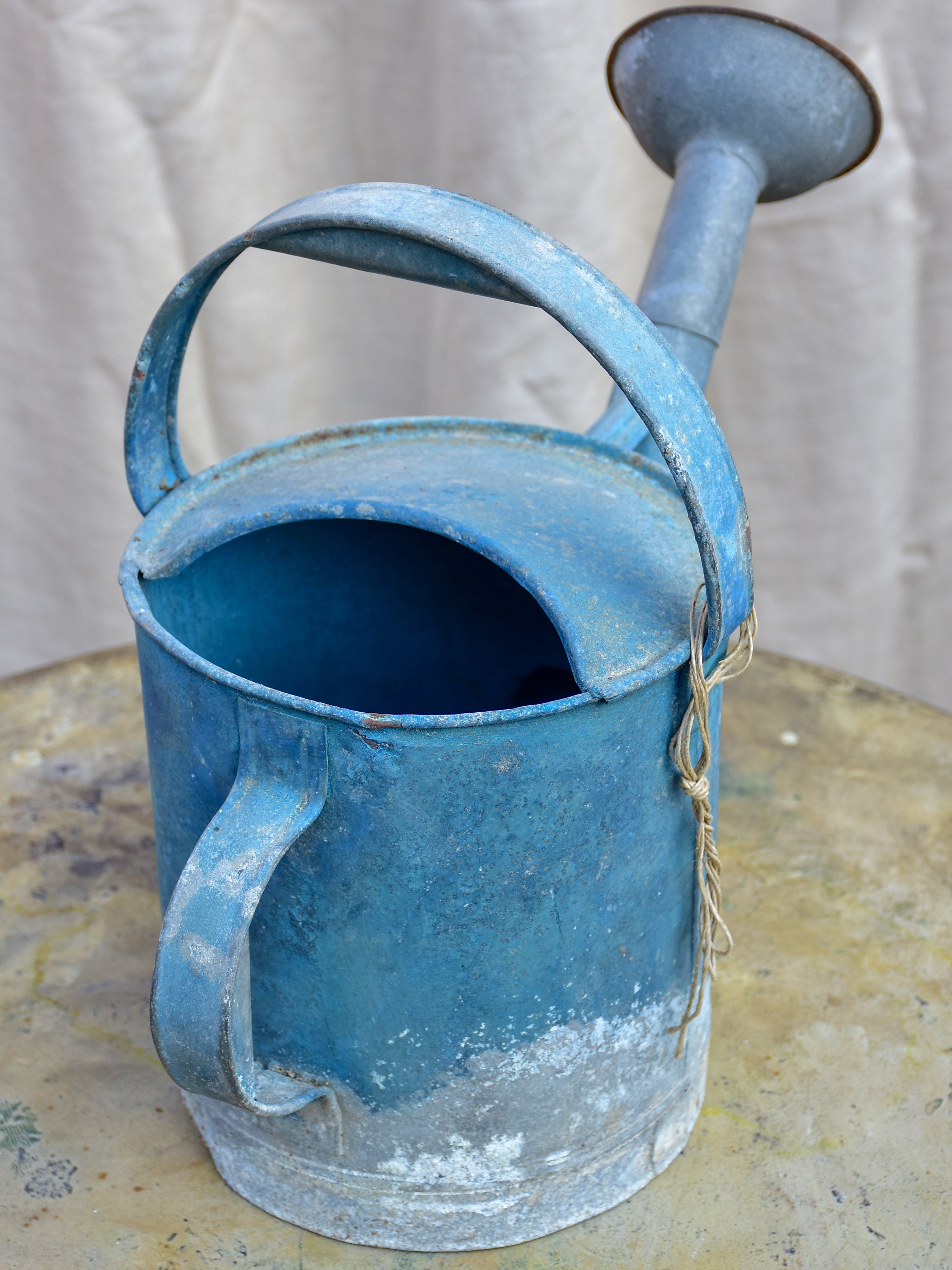 Antique French watering can with blue patina