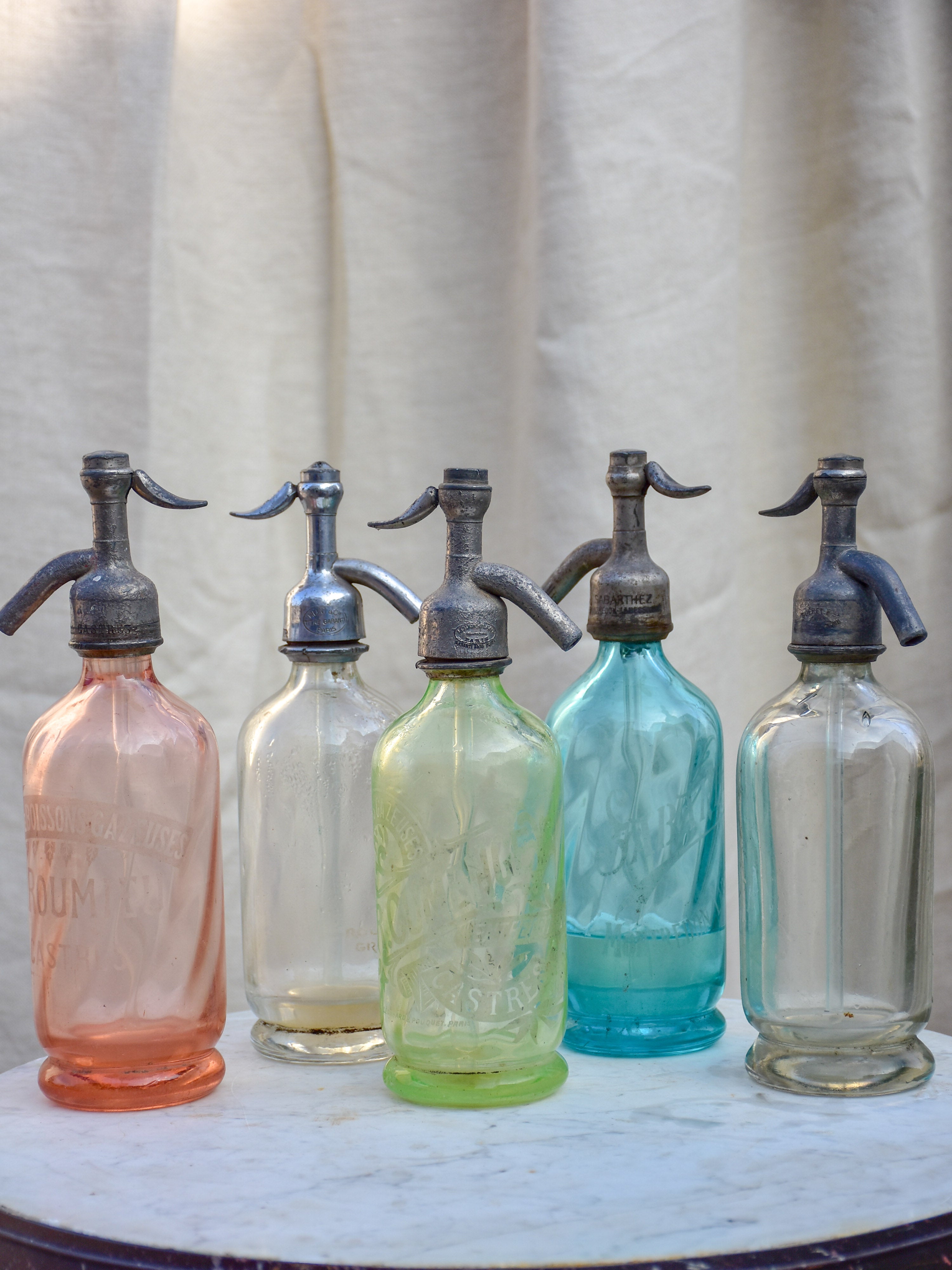 Collection of five antique French 'demi' seltzer bottles