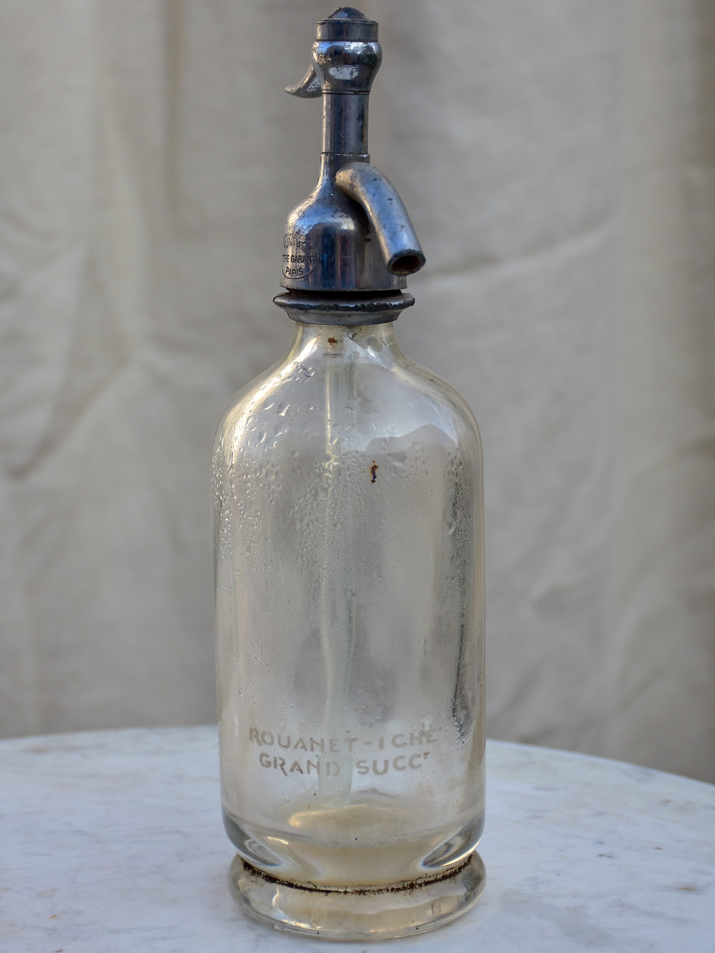 Collection of five antique French 'demi' seltzer bottles