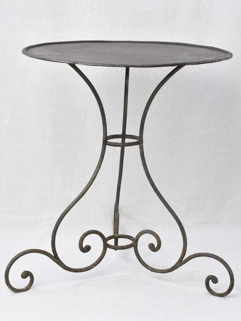 Pretty black garden table w/ scrolls