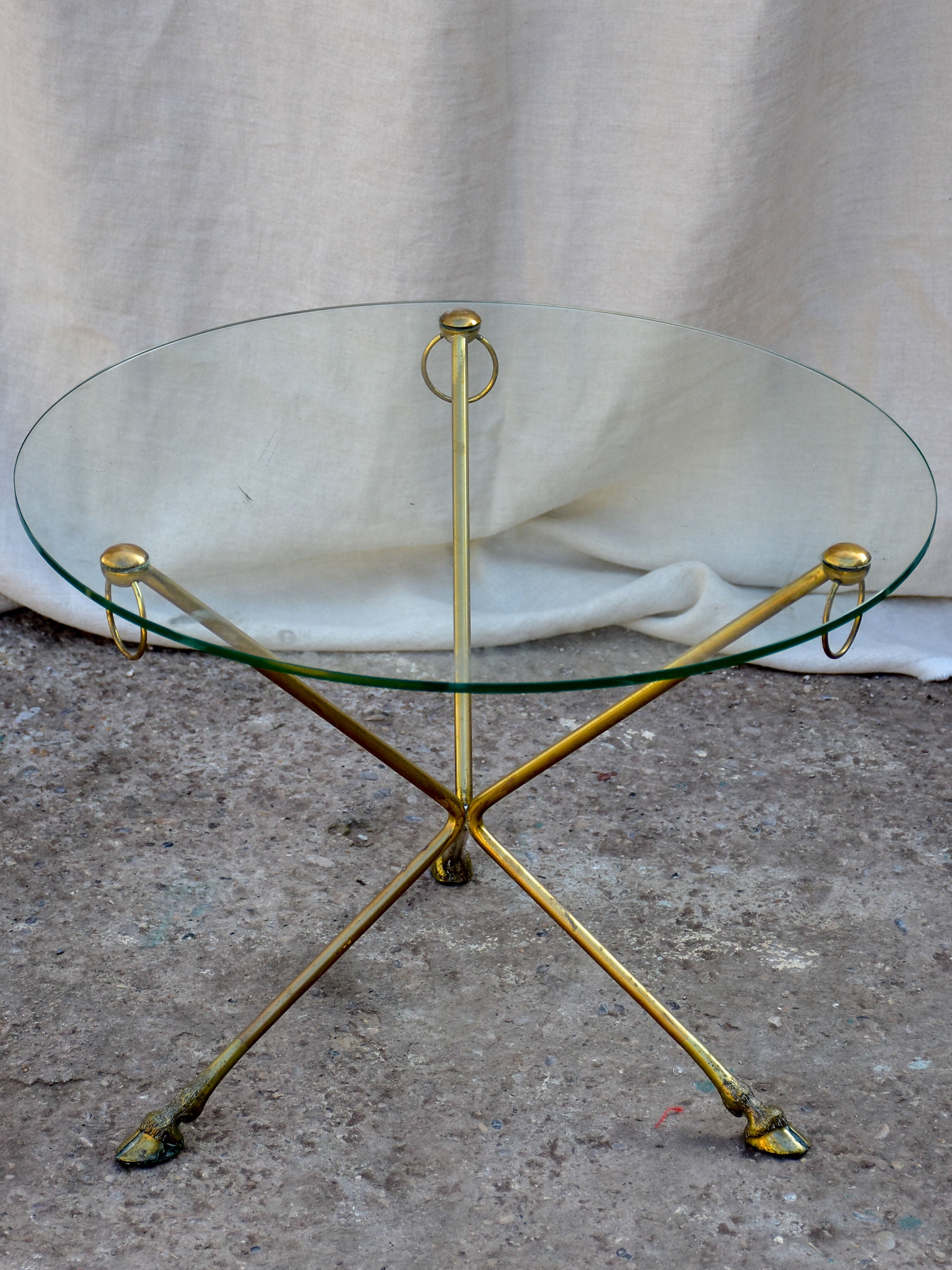 Vintage French coffee table with glass top and brass legs