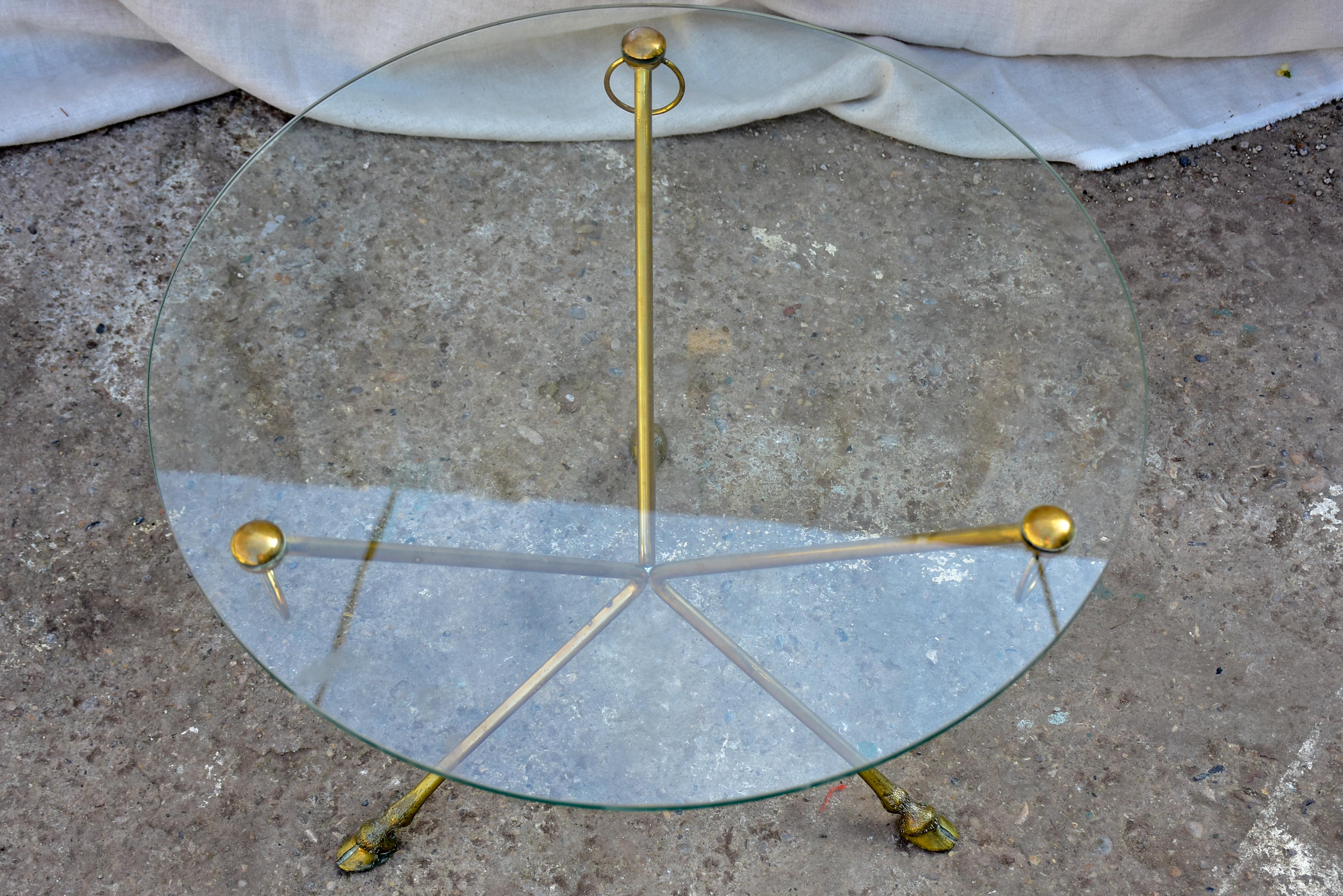 Vintage French coffee table with glass top and brass legs