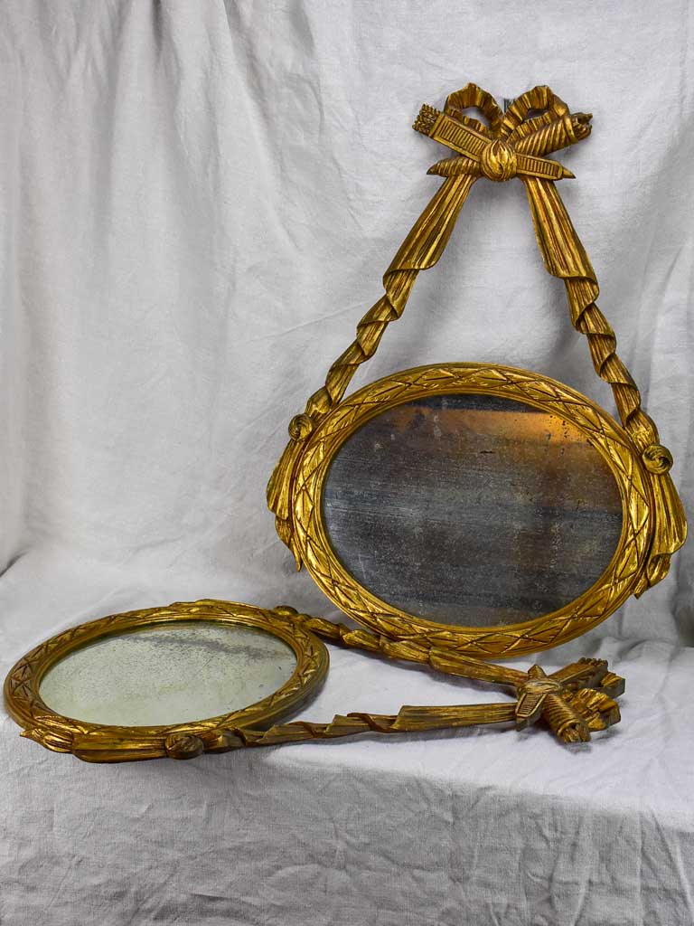 Pair of Louis XVI-style oval mirrors with carved wood frames 22" x 28¾"