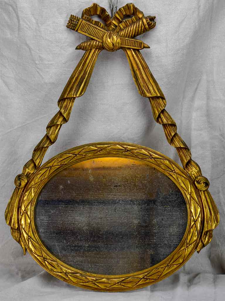 Pair of Louis XVI-style oval mirrors with carved wood frames 22" x 28¾"