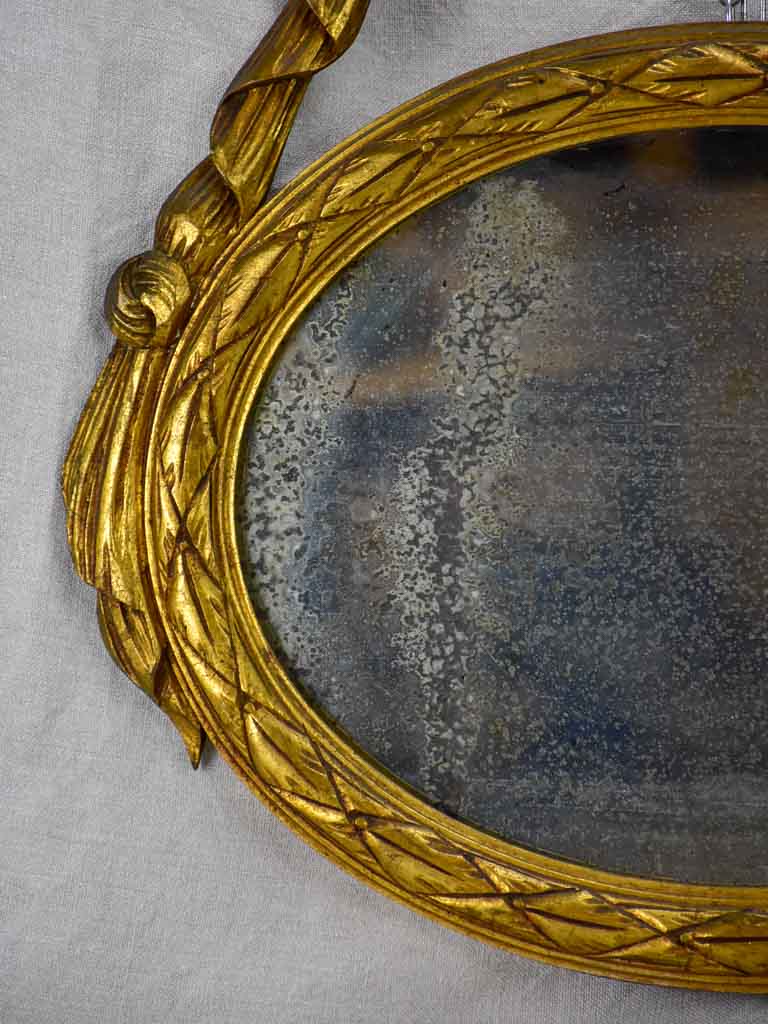 Pair of Louis XVI-style oval mirrors with carved wood frames 22" x 28¾"