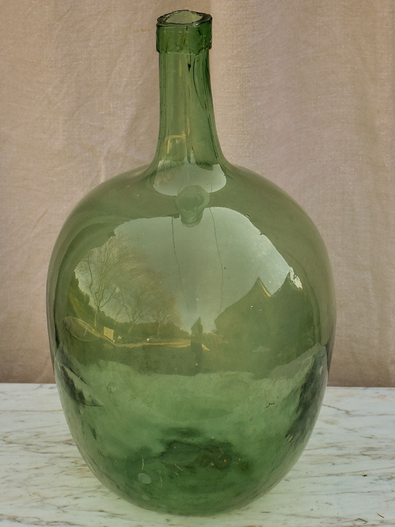 Two antique French demijohn bottles - oval blue green