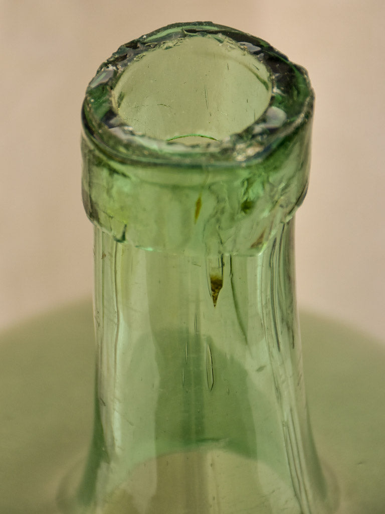 Two antique French demijohn bottles - oval blue green