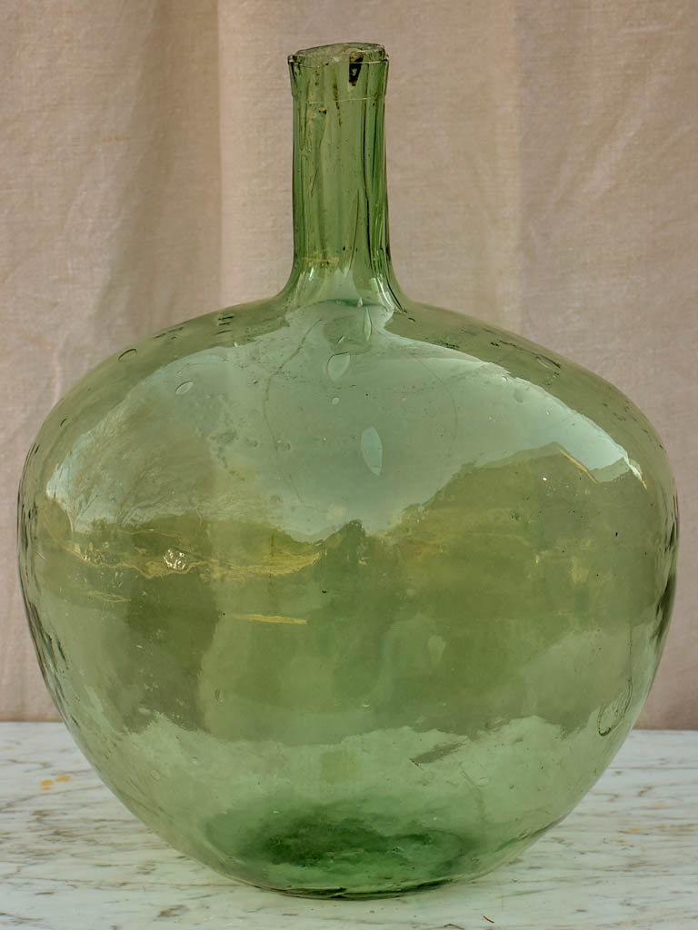 Two antique French demijohn bottles - oval blue green