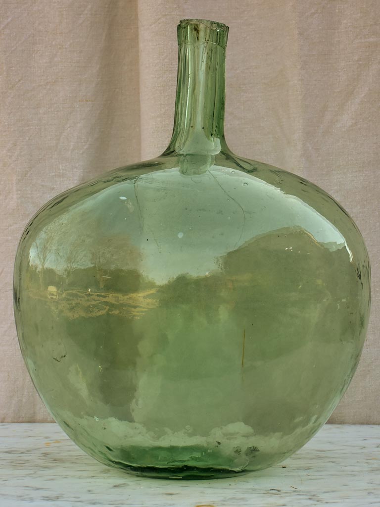 Two antique French demijohn bottles - oval blue green