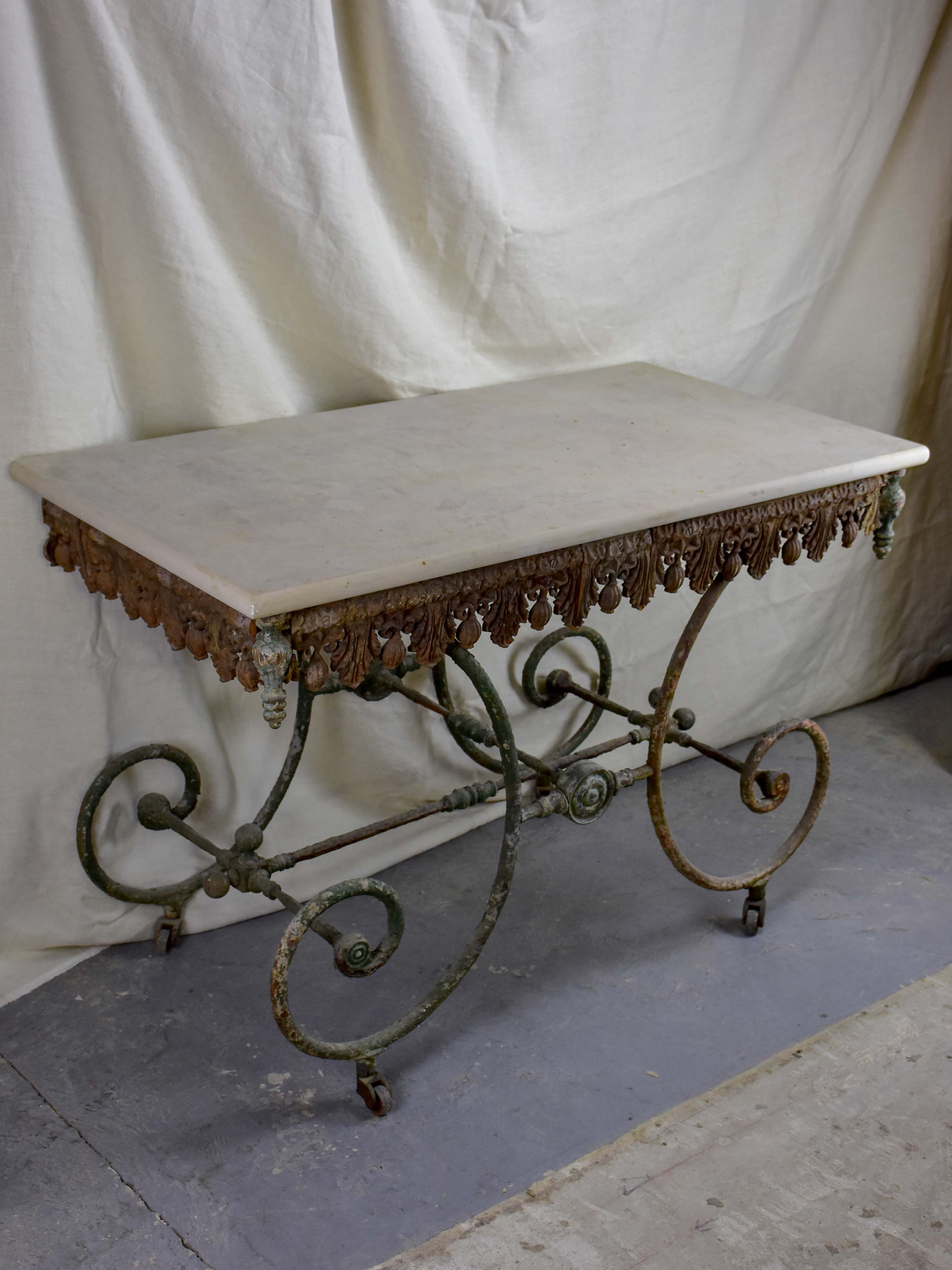 19th Century French butcher's table with marble top and wheels