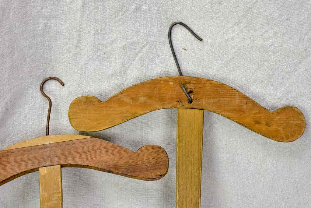 Two antique French coat hangers