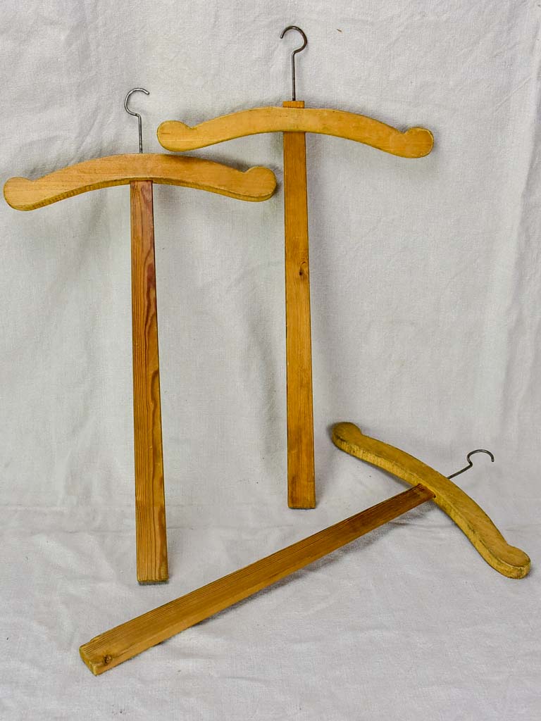 Three antique French coat hangers