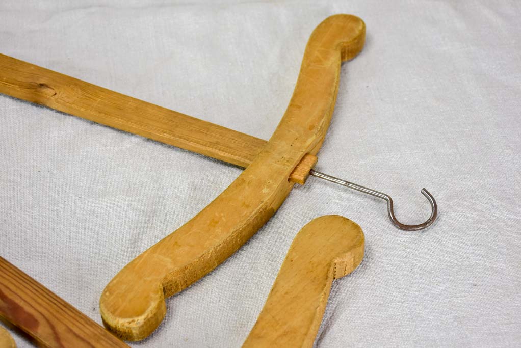 Three antique French coat hangers