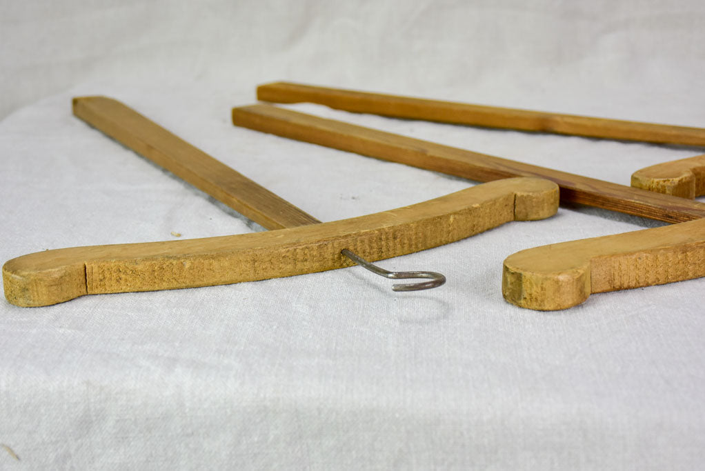 Three antique French coat hangers