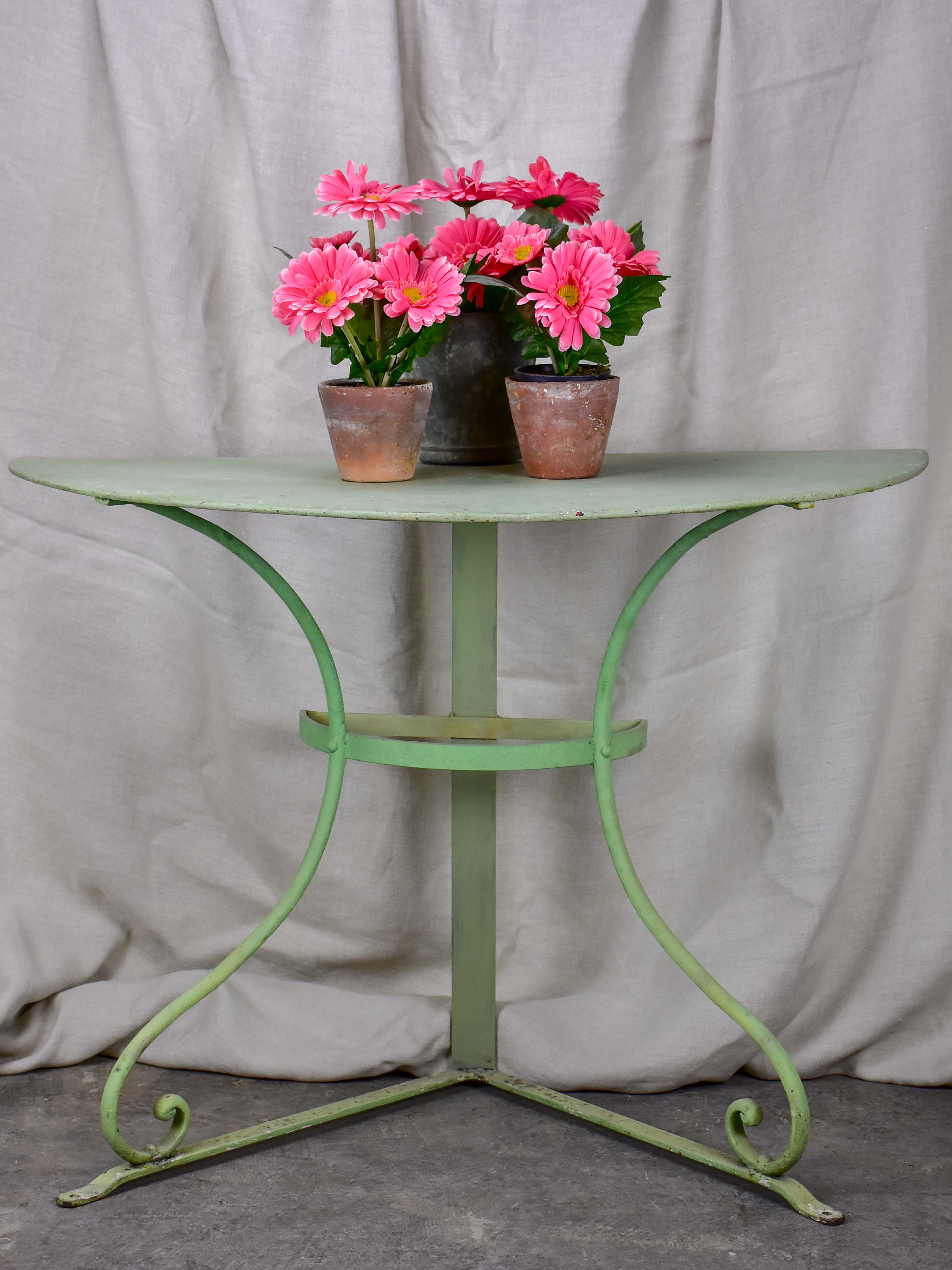 Pair of antique French half-moon garden tables