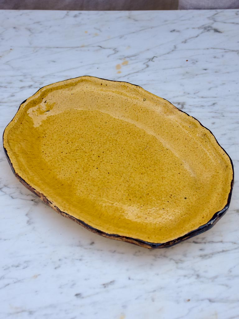 Antique French oval Dieulefit plate - yellow with 'burnt' edge