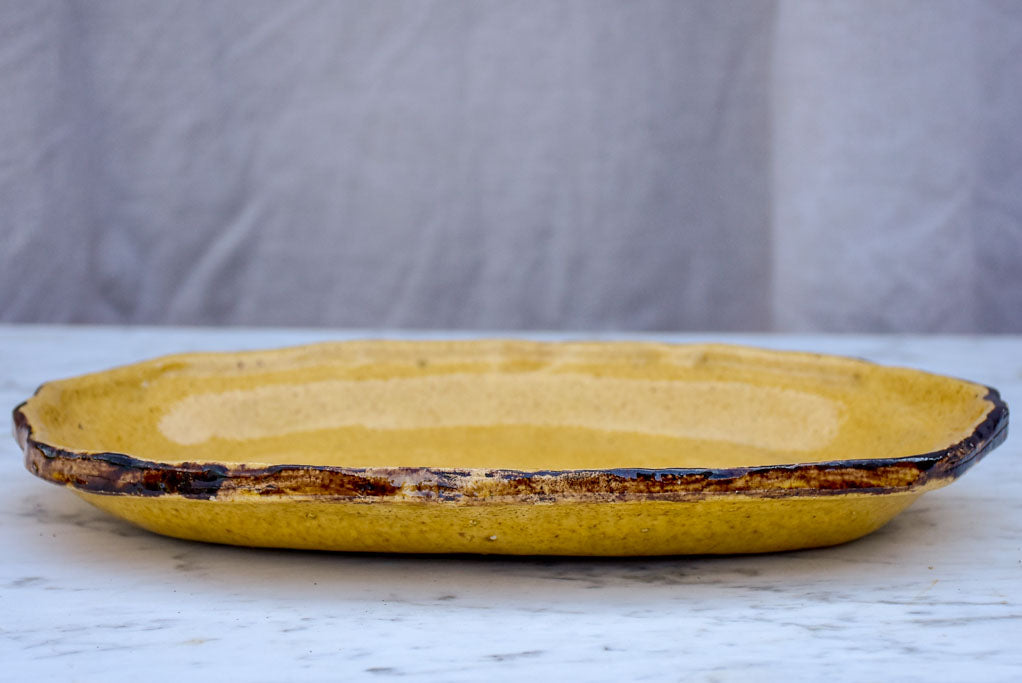 Antique French oval Dieulefit plate - yellow with 'burnt' edge