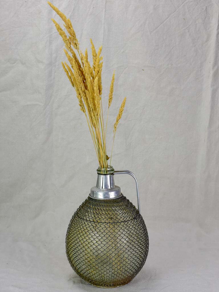 Mid century wine demijohn in mesh from Savoy 9""