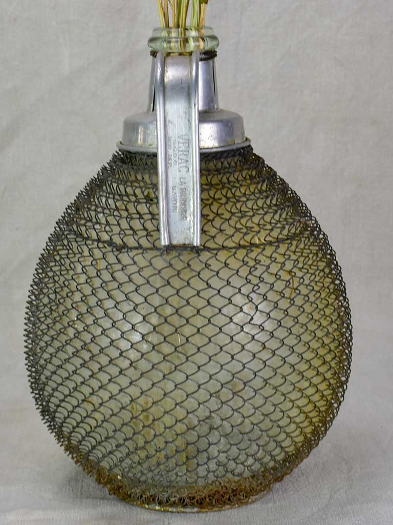 Mid century wine demijohn in mesh from Savoy 9""