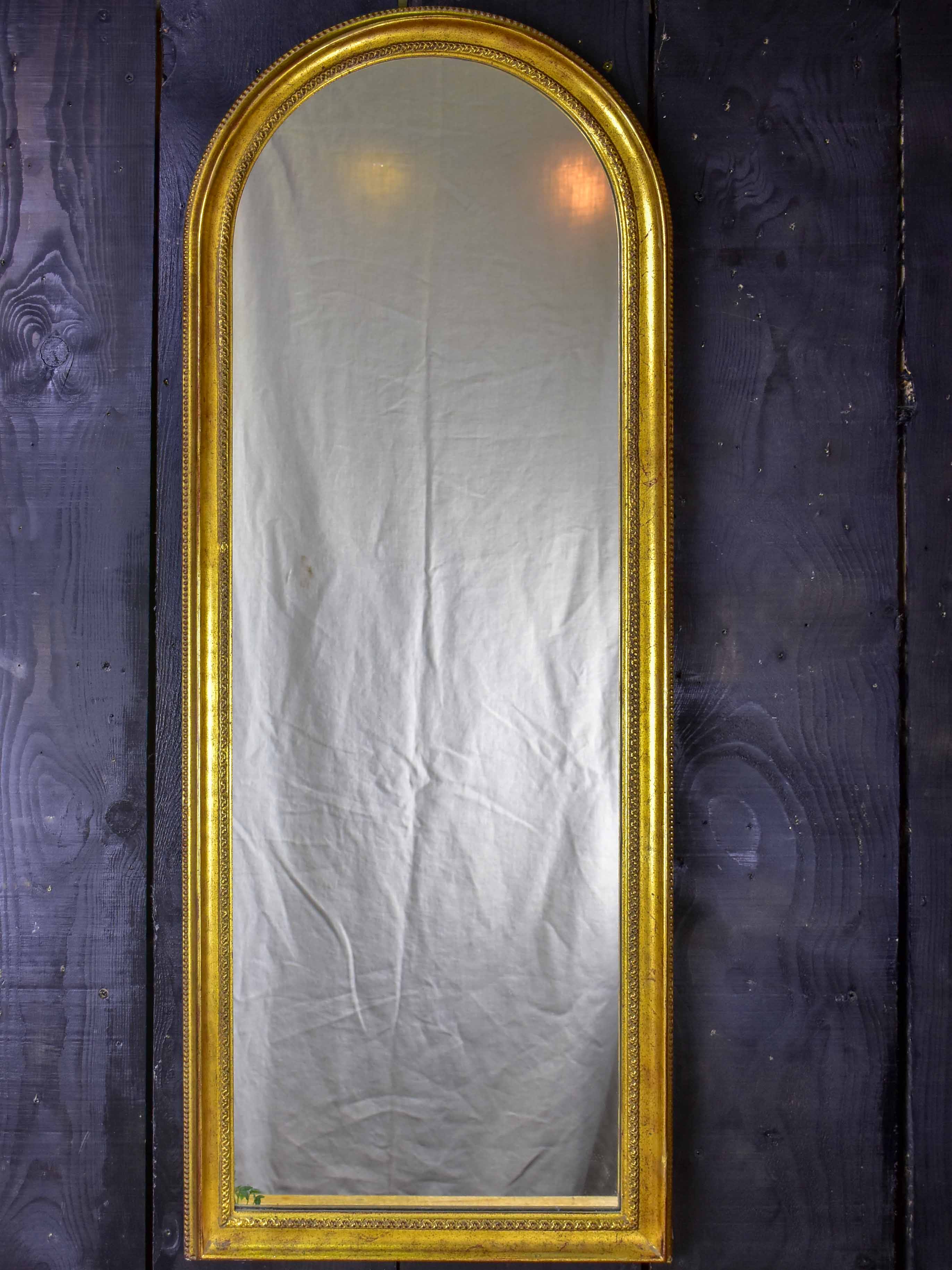 Vintage French arched mirror with gilded frame