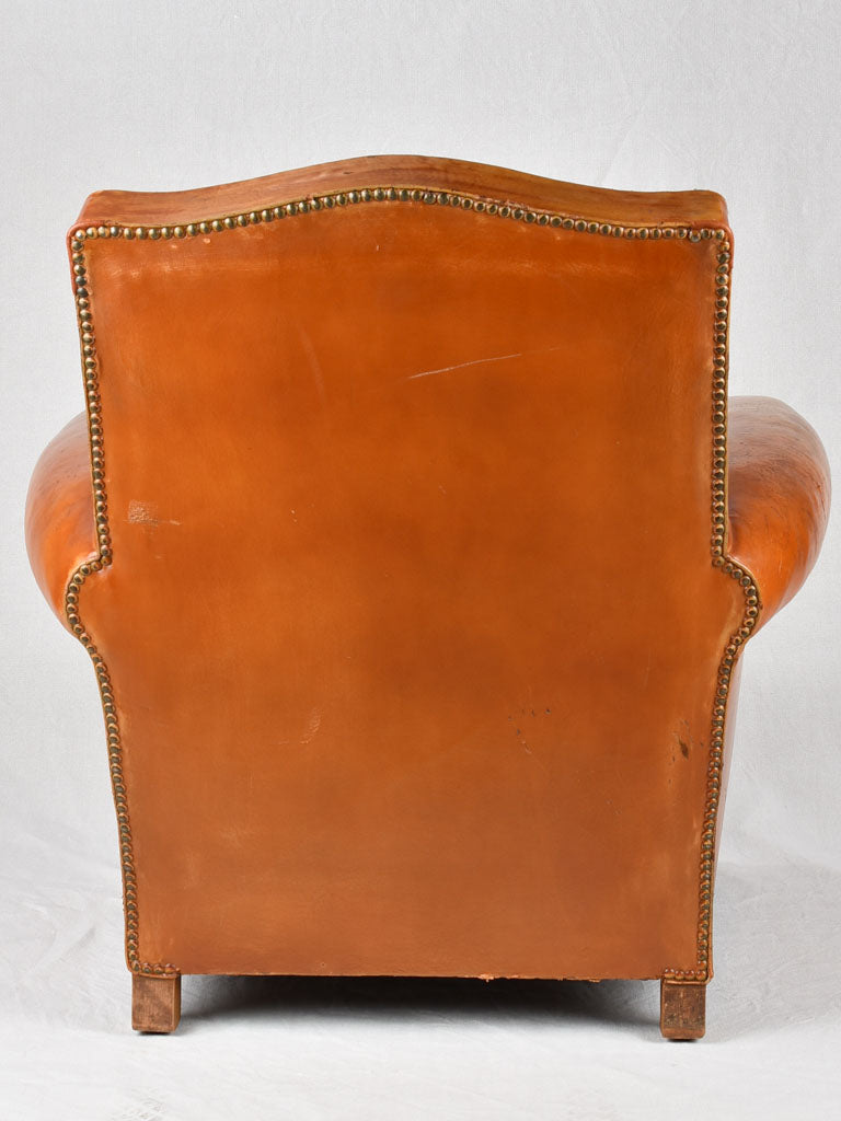 Vintage French leather club chair with chapeau gendarme back