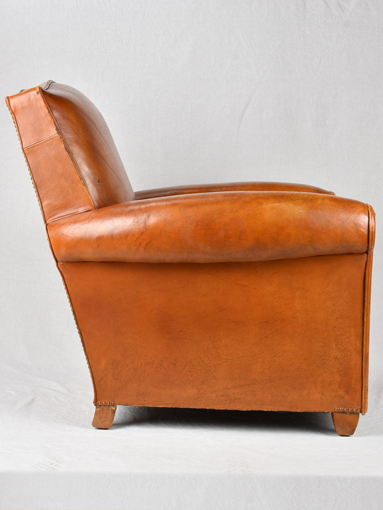 Vintage French leather club chair with chapeau gendarme back