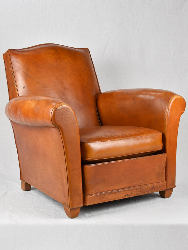 Vintage French leather club chair with chapeau gendarme back