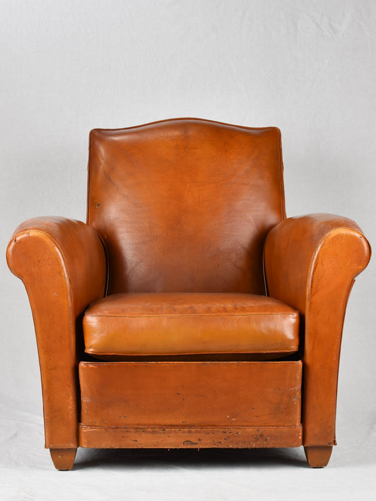 Vintage French leather club chair with chapeau gendarme back