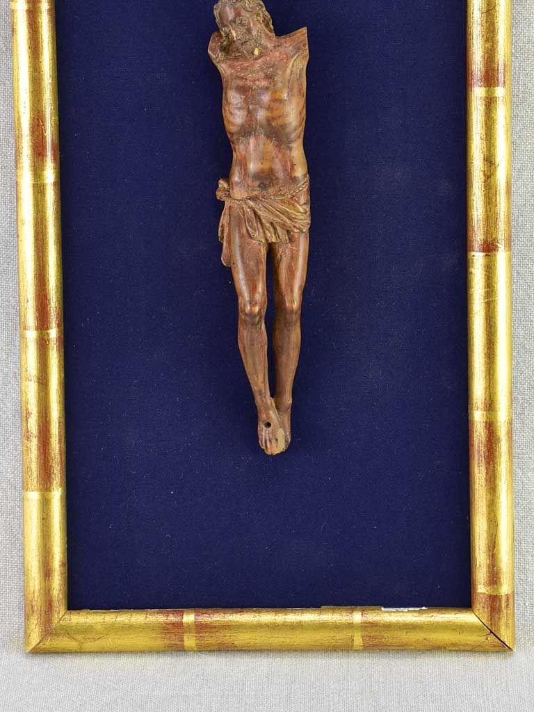 18th Century sculpture of Jesus Christ on blue fabric in gold frame