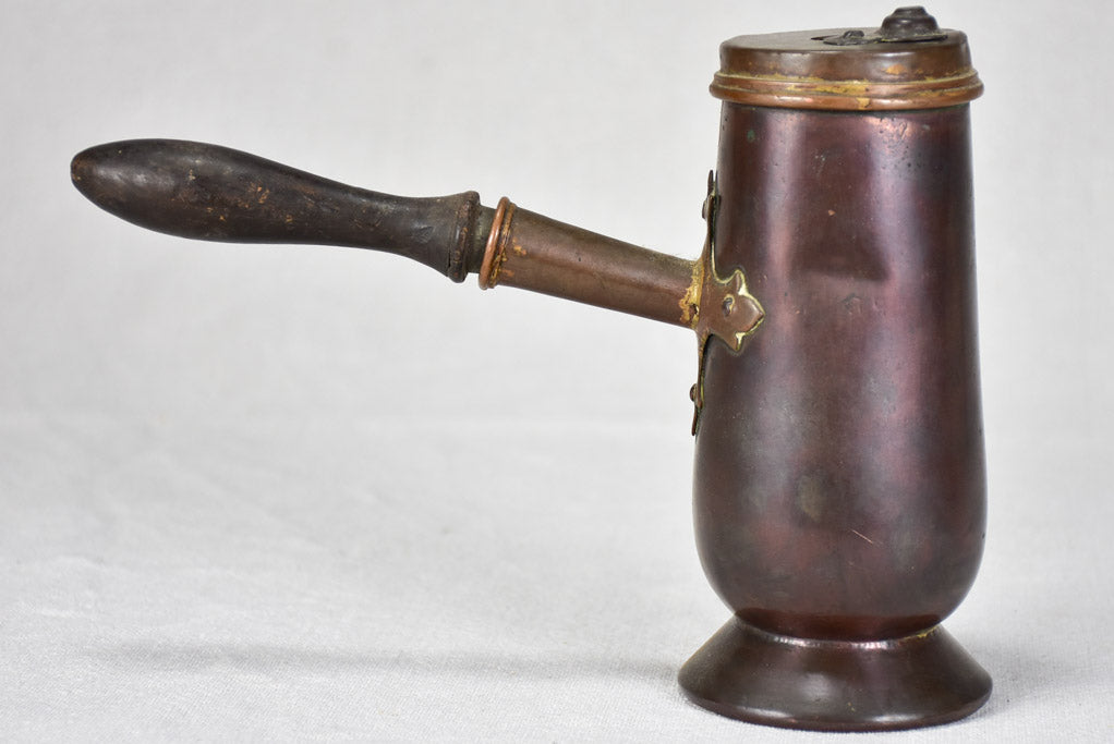 Classic antique red-colored chocolate pot