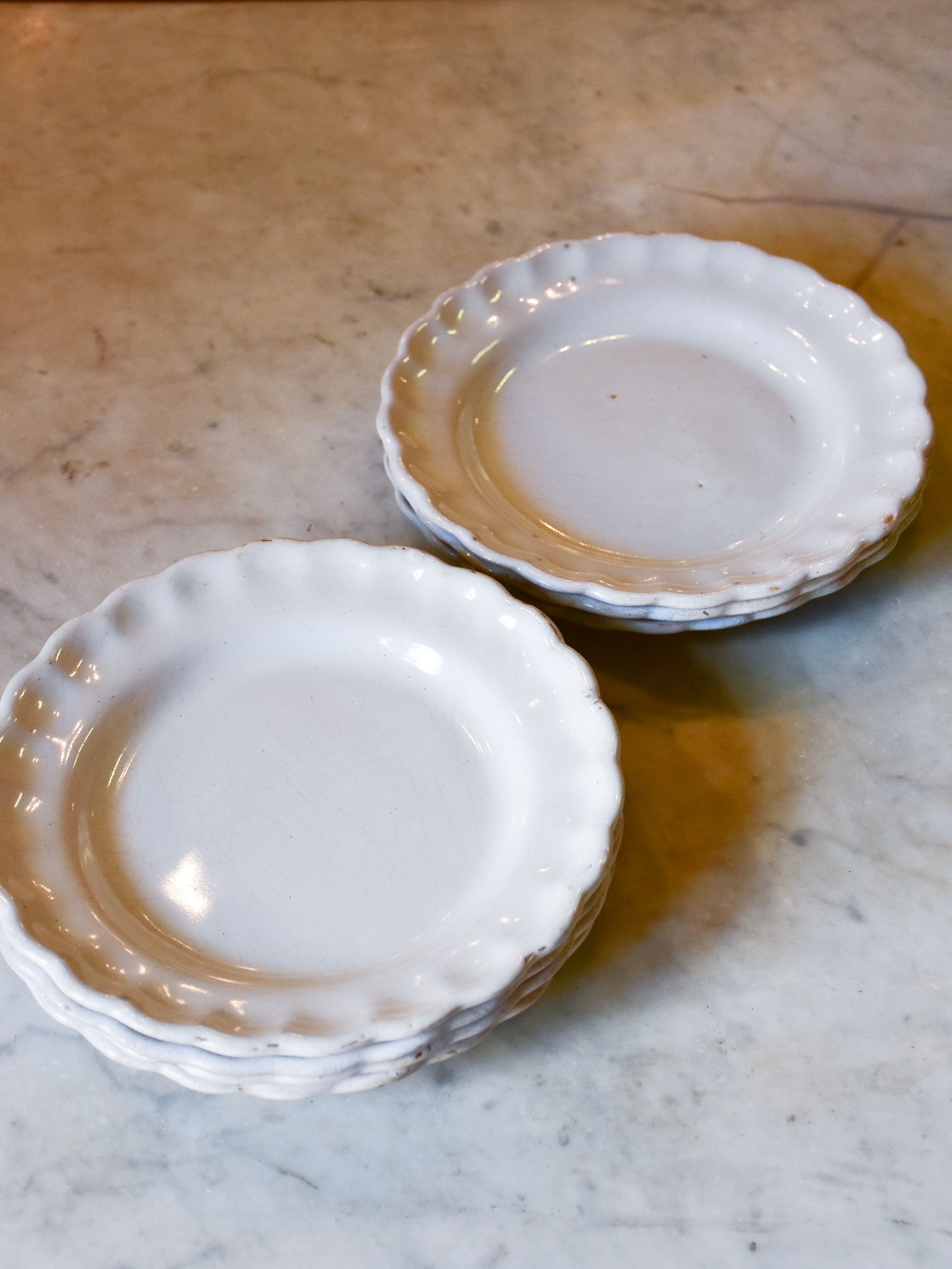 Collection of 7 antique French ironstone plates with rippled edge