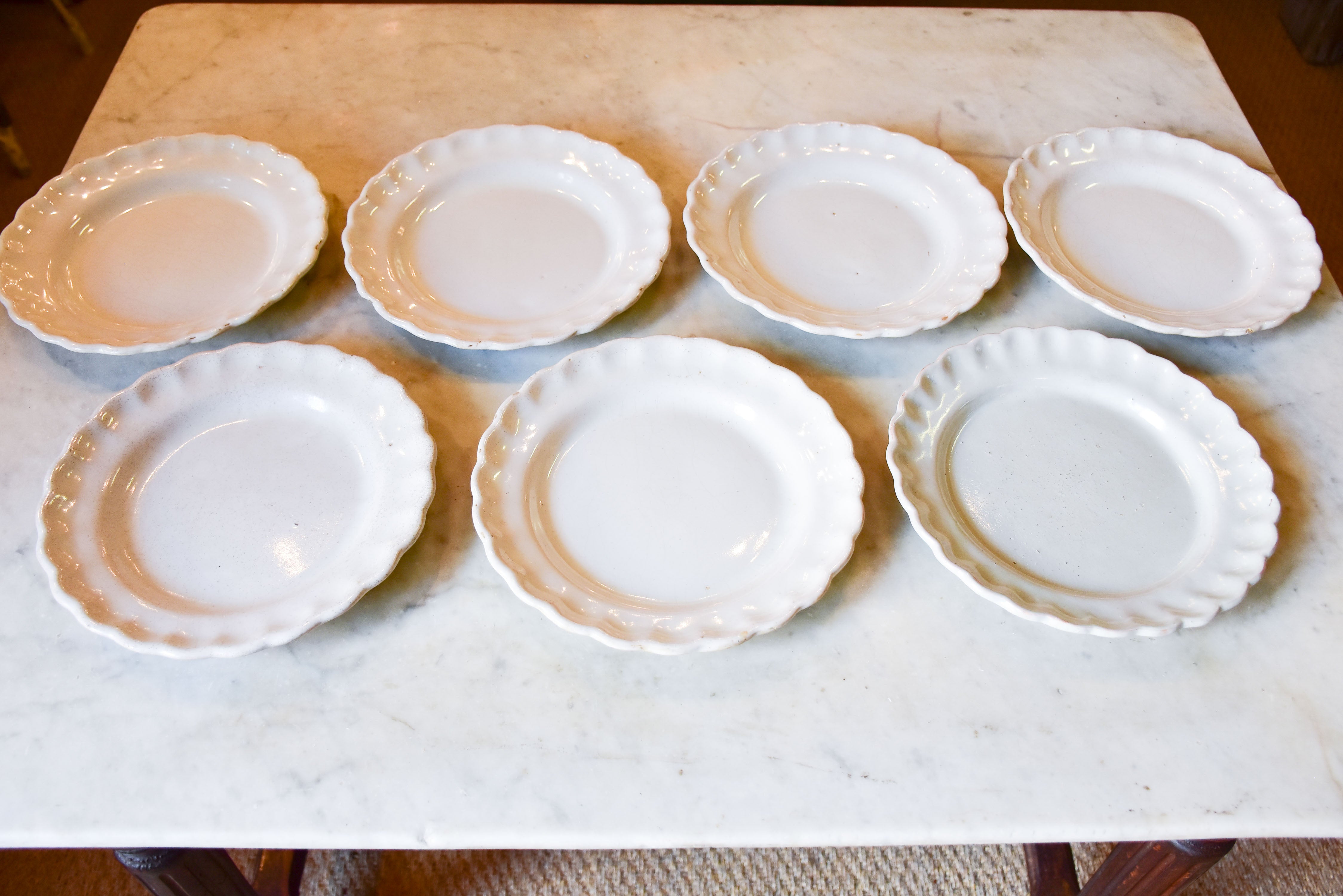 Collection of 7 antique French ironstone plates with rippled edge