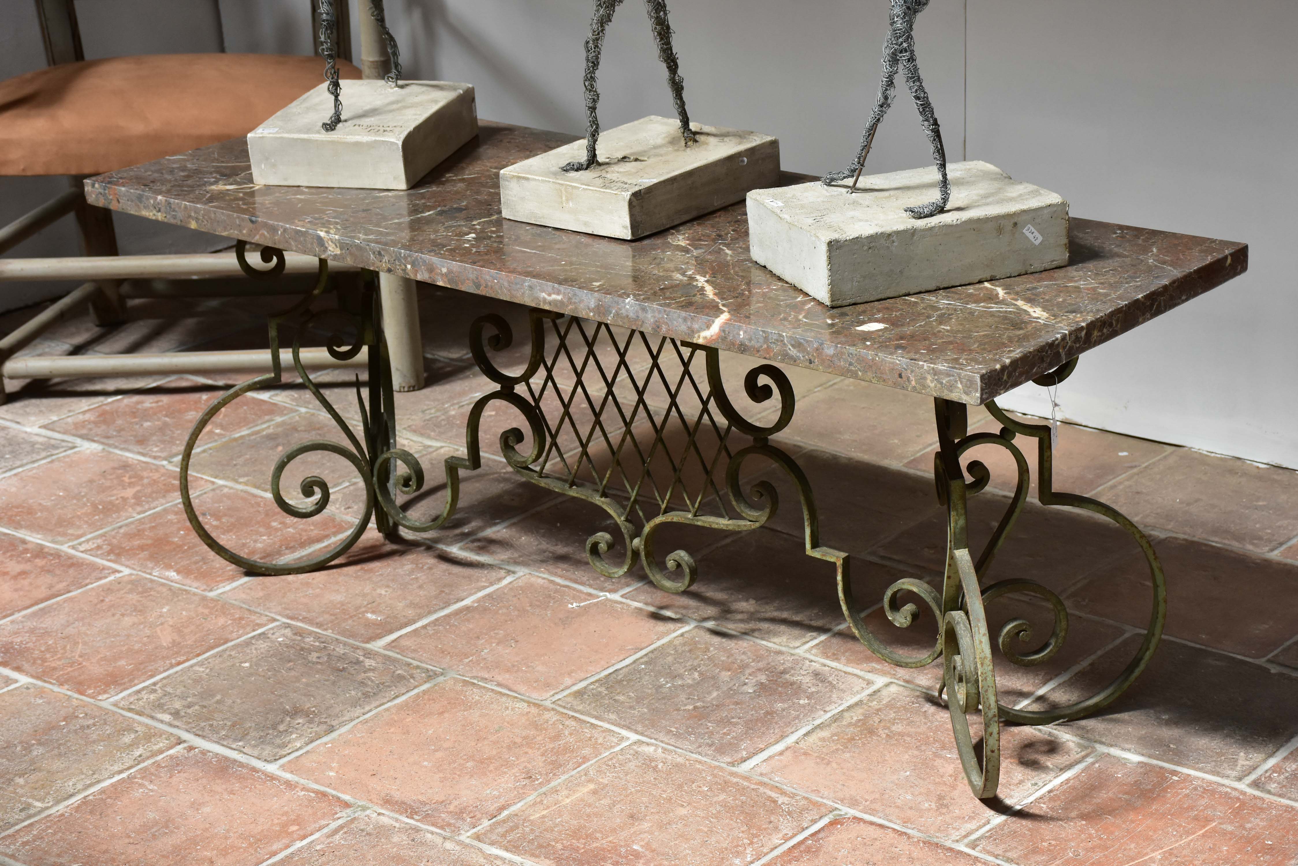 Marble top coffee table with decorative wrought iron base