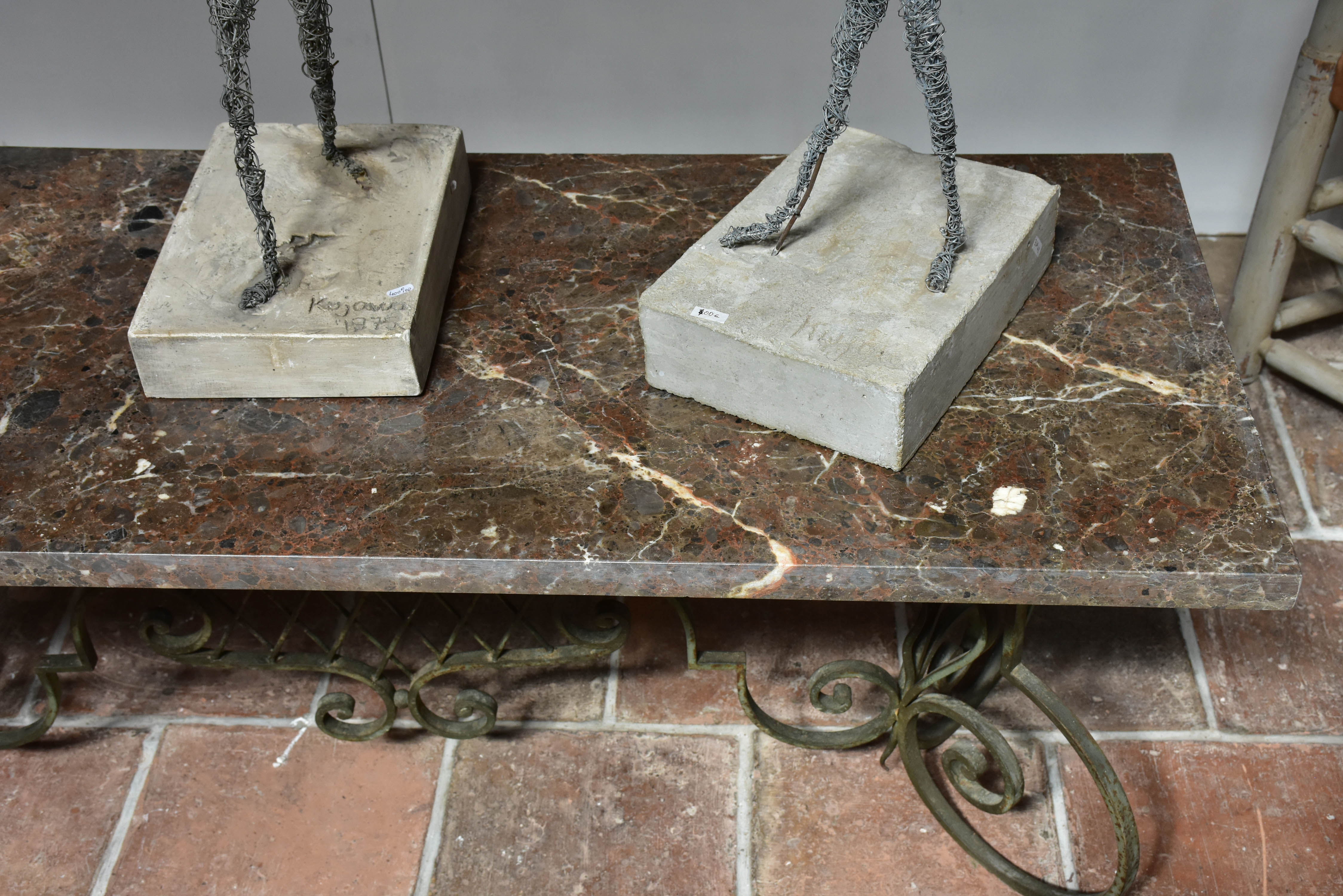 Marble top coffee table with decorative wrought iron base