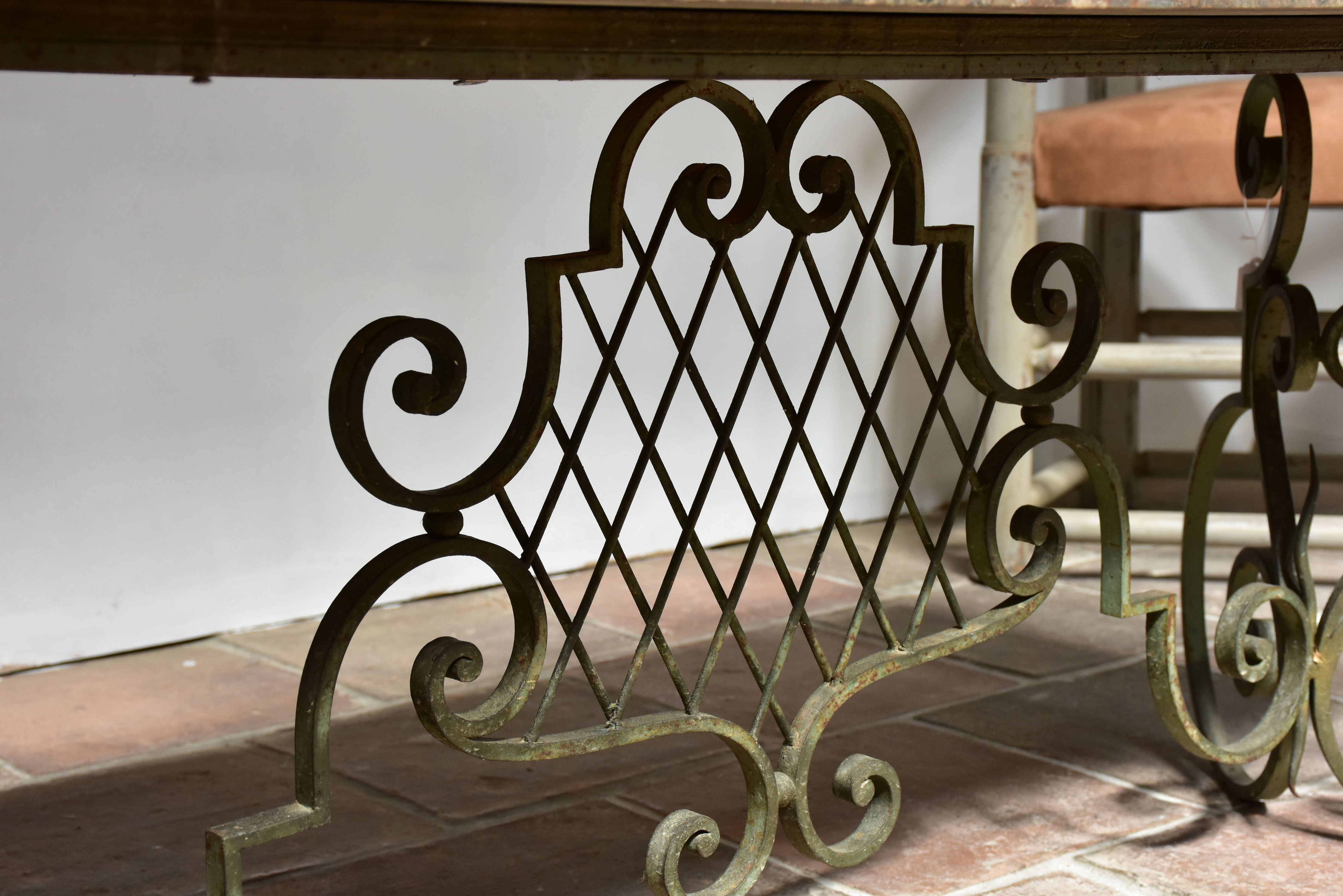 Marble top coffee table with decorative wrought iron base