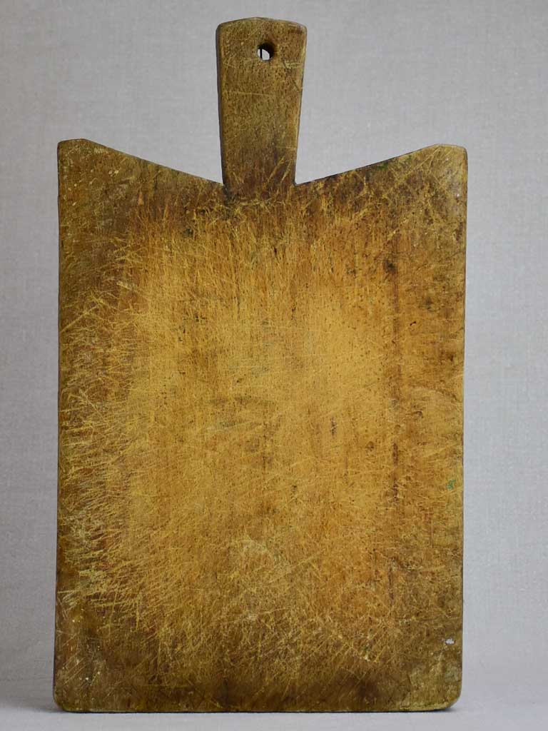 Small antique French cutting board with peaked shoulders 15¾" x 9½"