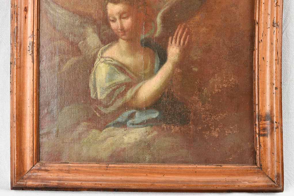 17th century painting of an angel in prayer in arched wooden frame 24" x 27¼"